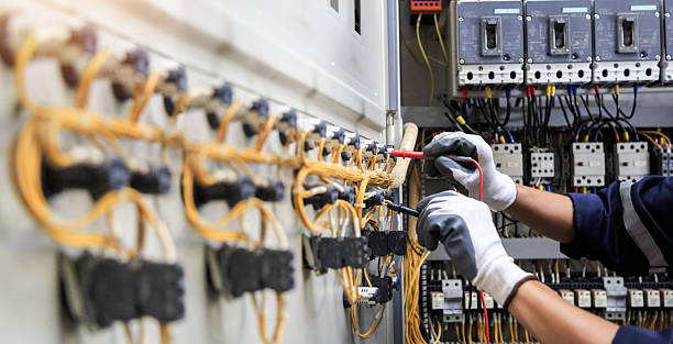 Professional Electrician technician working in Commerce, TX